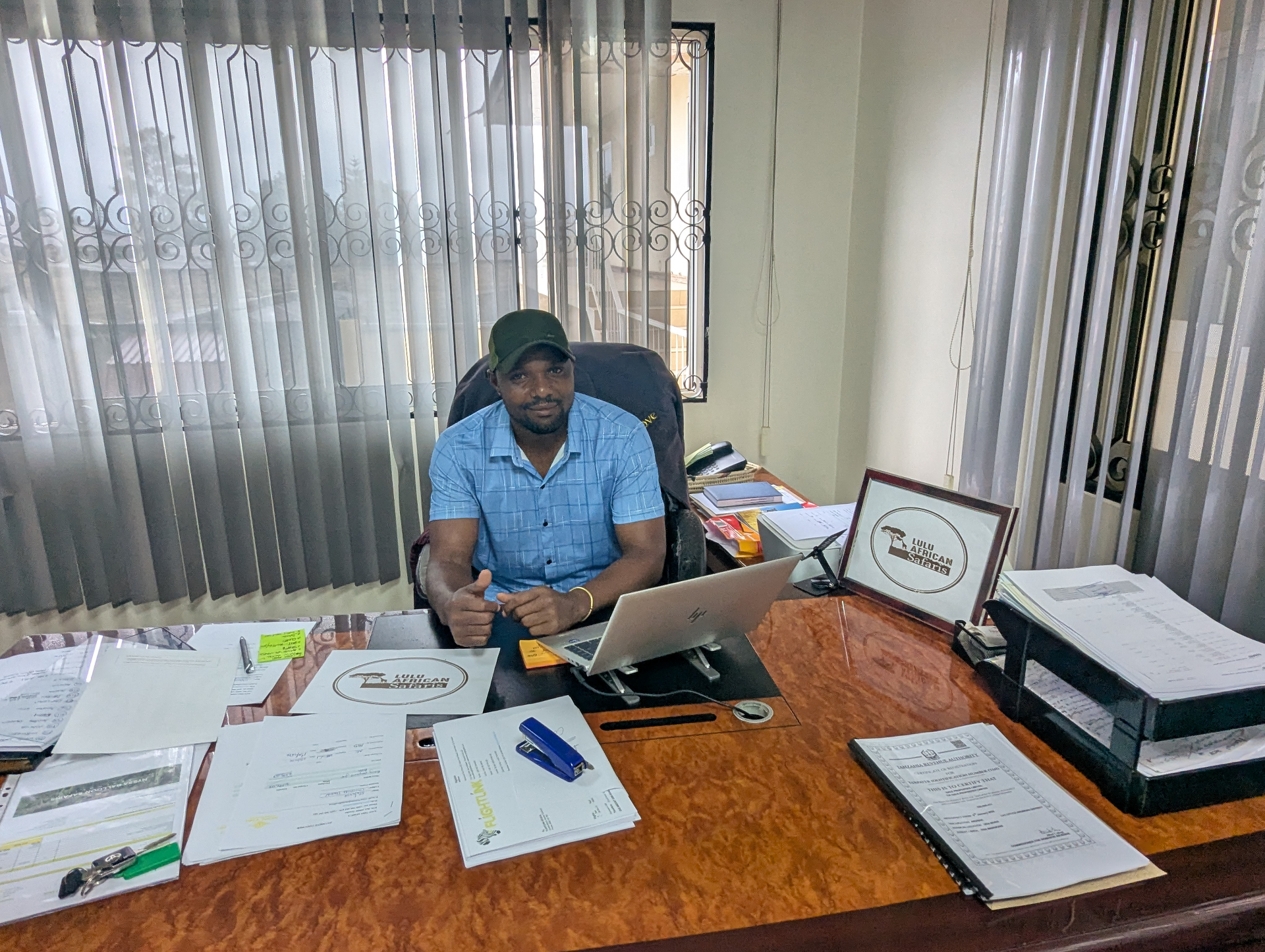 Frank, founder of Lulu African Safaris, at his desk in the Arusha office