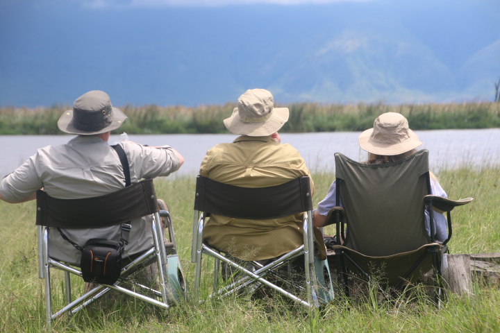 Lulu guests seated lakeside watching wildlife
